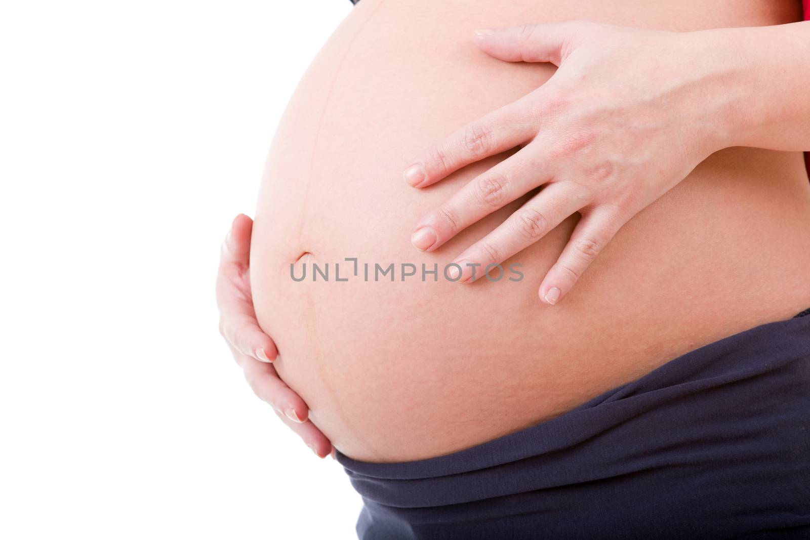 Closeup of pregnant woman at white background