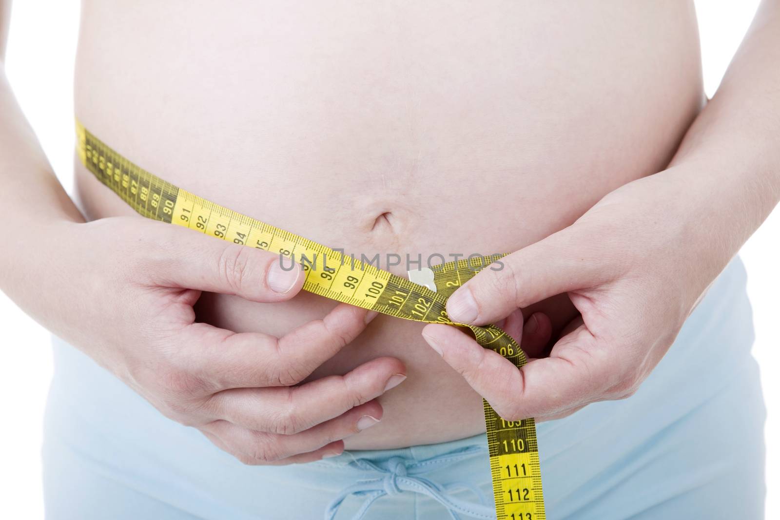 Closeup of pregnant woman at white background