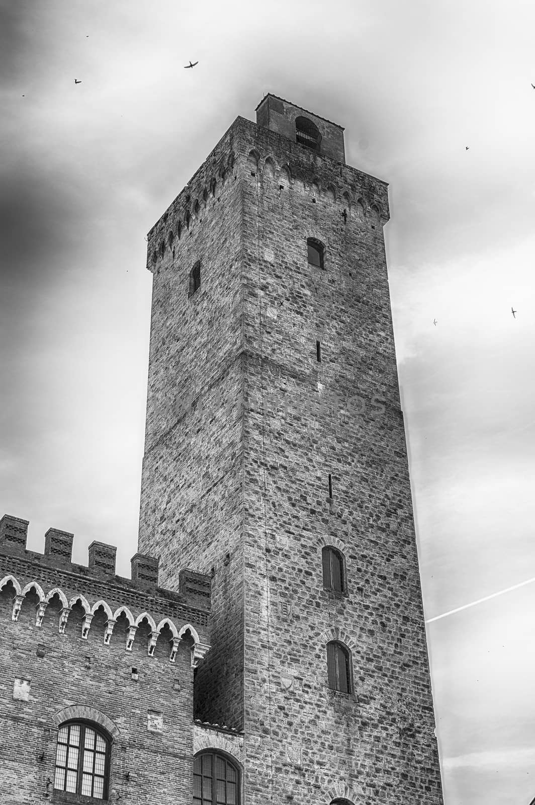 View of Torre Grossa, the tallest medieval tower and one of the main attractions in the central square of San Gimignano, Tuscany, Italy