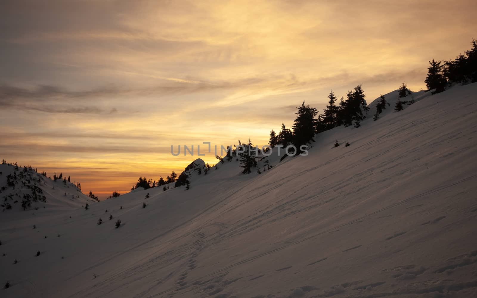 Sunset view from Mount Ciucas on winter, part of Romanian Carpathian Range