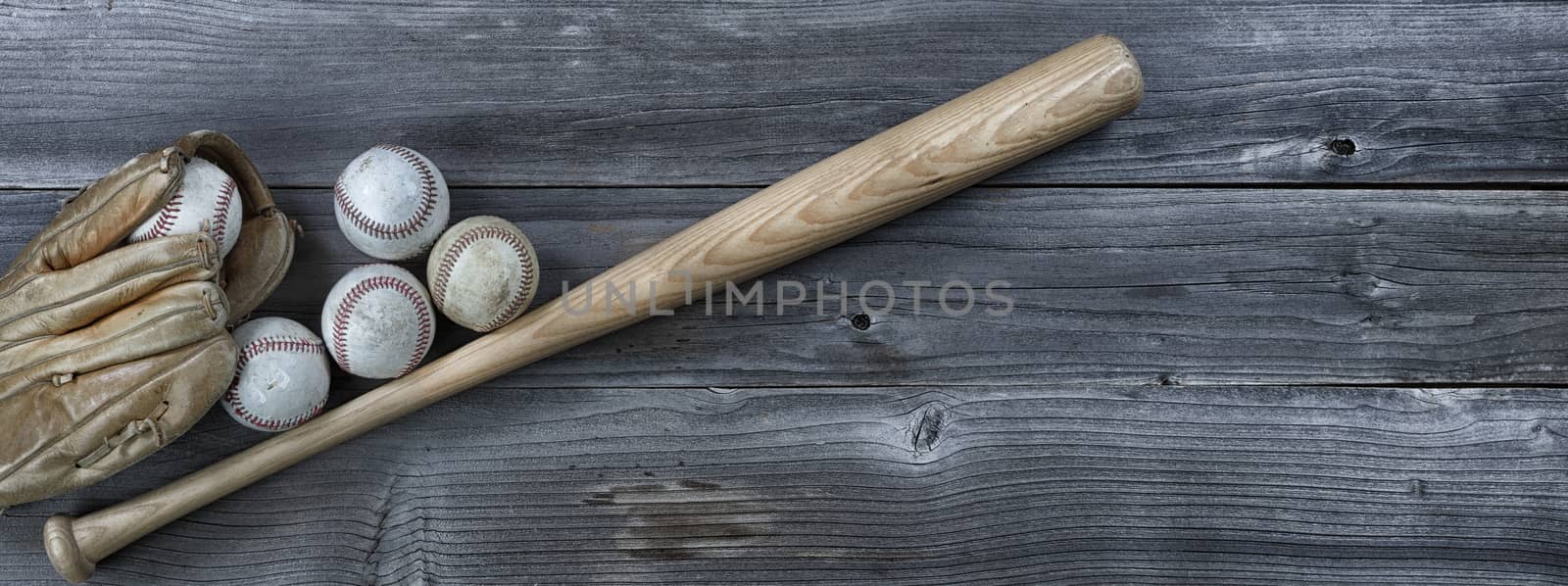 Used baseball equipment on vintage wooden background. Baseball s by tab1962