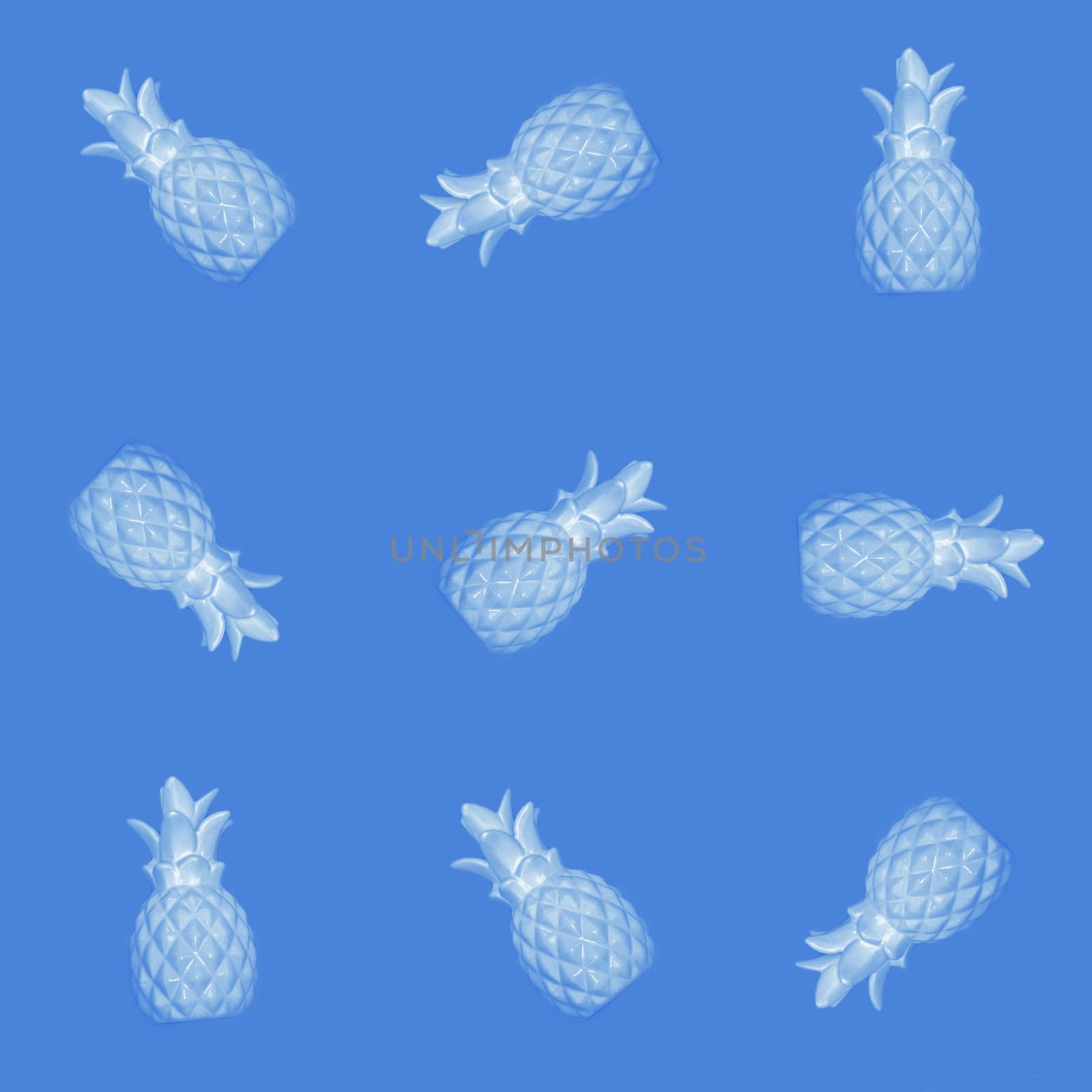 Seamless abstract background of blue pineapples on a blue background.