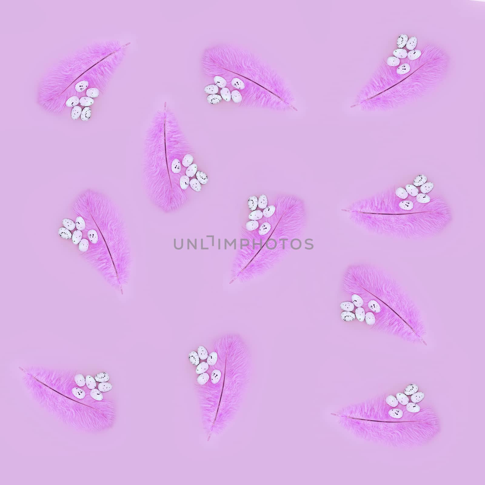 Seamless texture of pink feather and eggs on a pink background. Easter concept