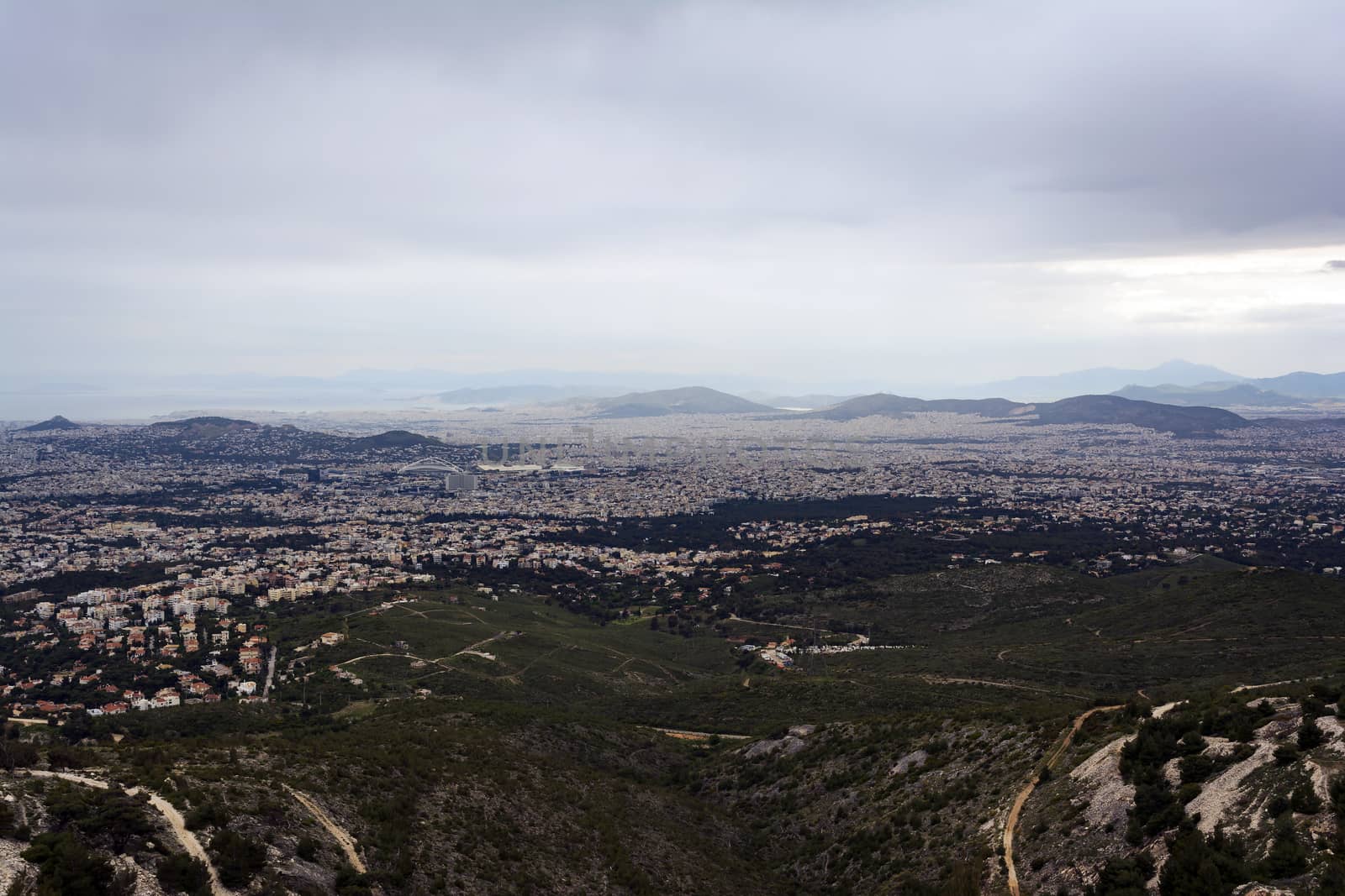 Panoramic view of cloudy Athens, taken shot from Penteli mountain. Greece.