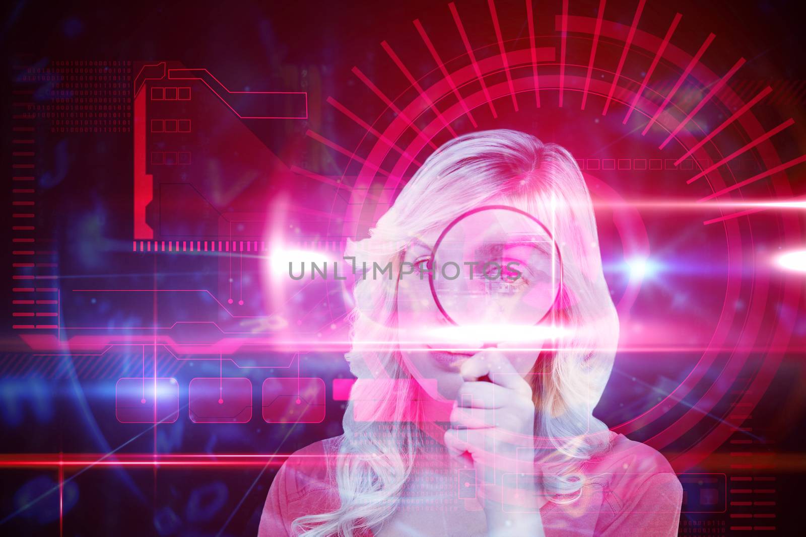 Fair-haired woman looking through a magnifying glass against red technology interface with light