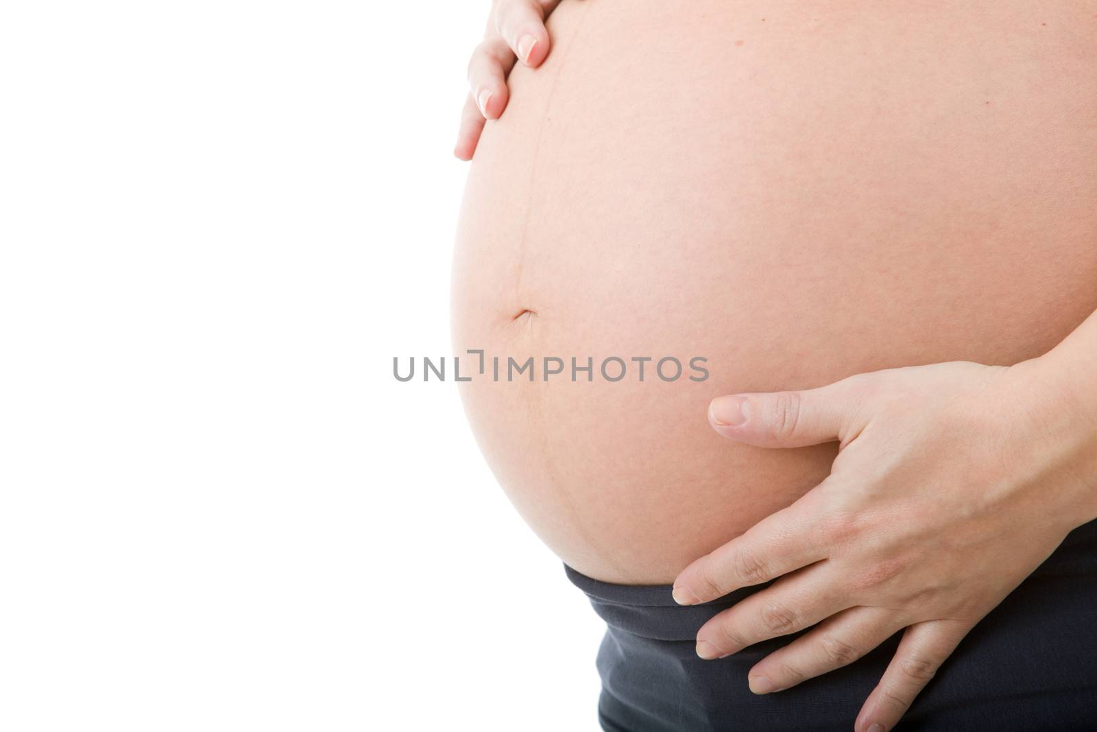 Closeup of pregnant woman at white background