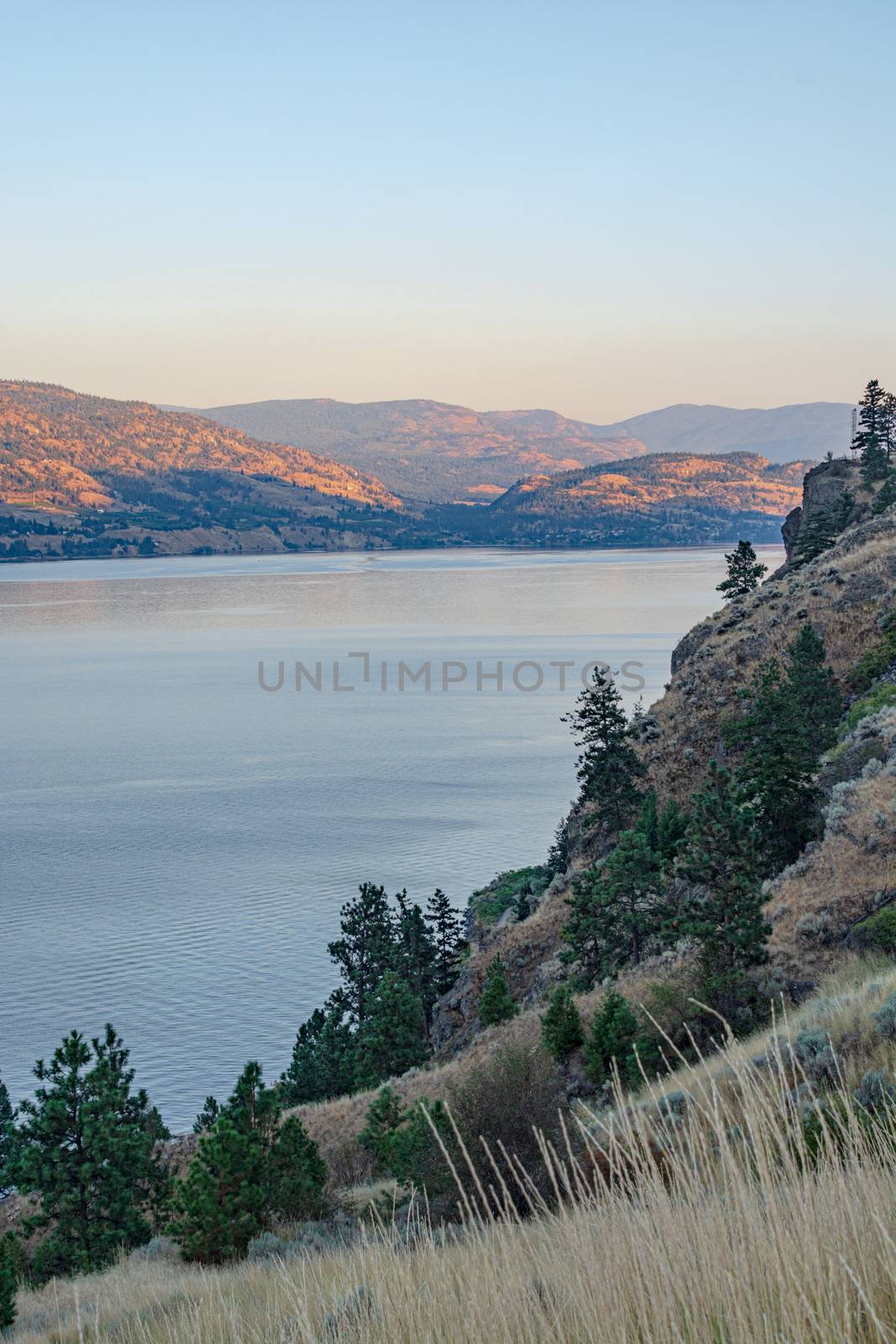Scenery overview of Okanagan lake on summer sunset by Imagenet