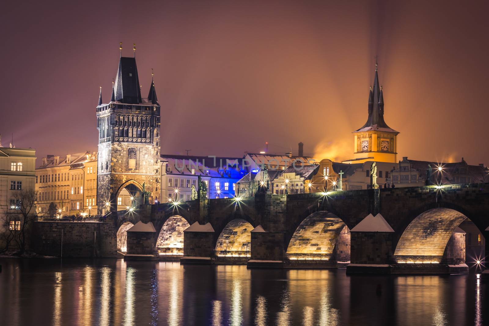 Prague at night, Charles Bridge and its tower from across the river. by petrsvoboda91