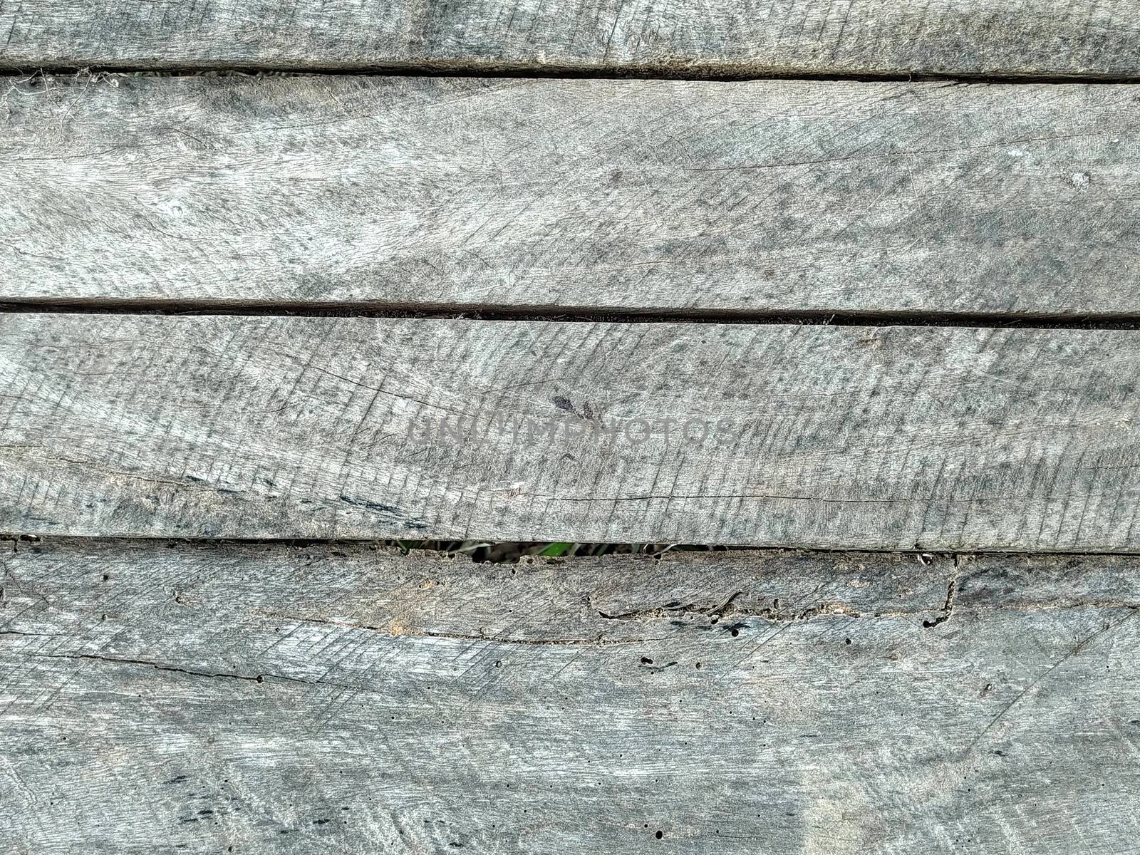 The pattern of the surface of the dry wood background. Rough pattern of the old wood