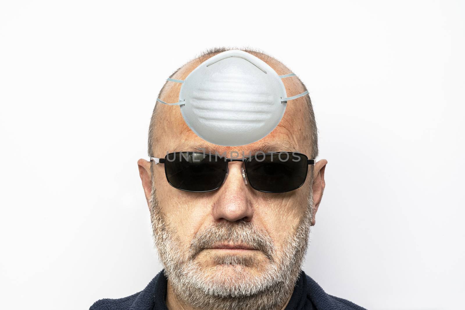 a man who is protecting his brain from panic with a mask