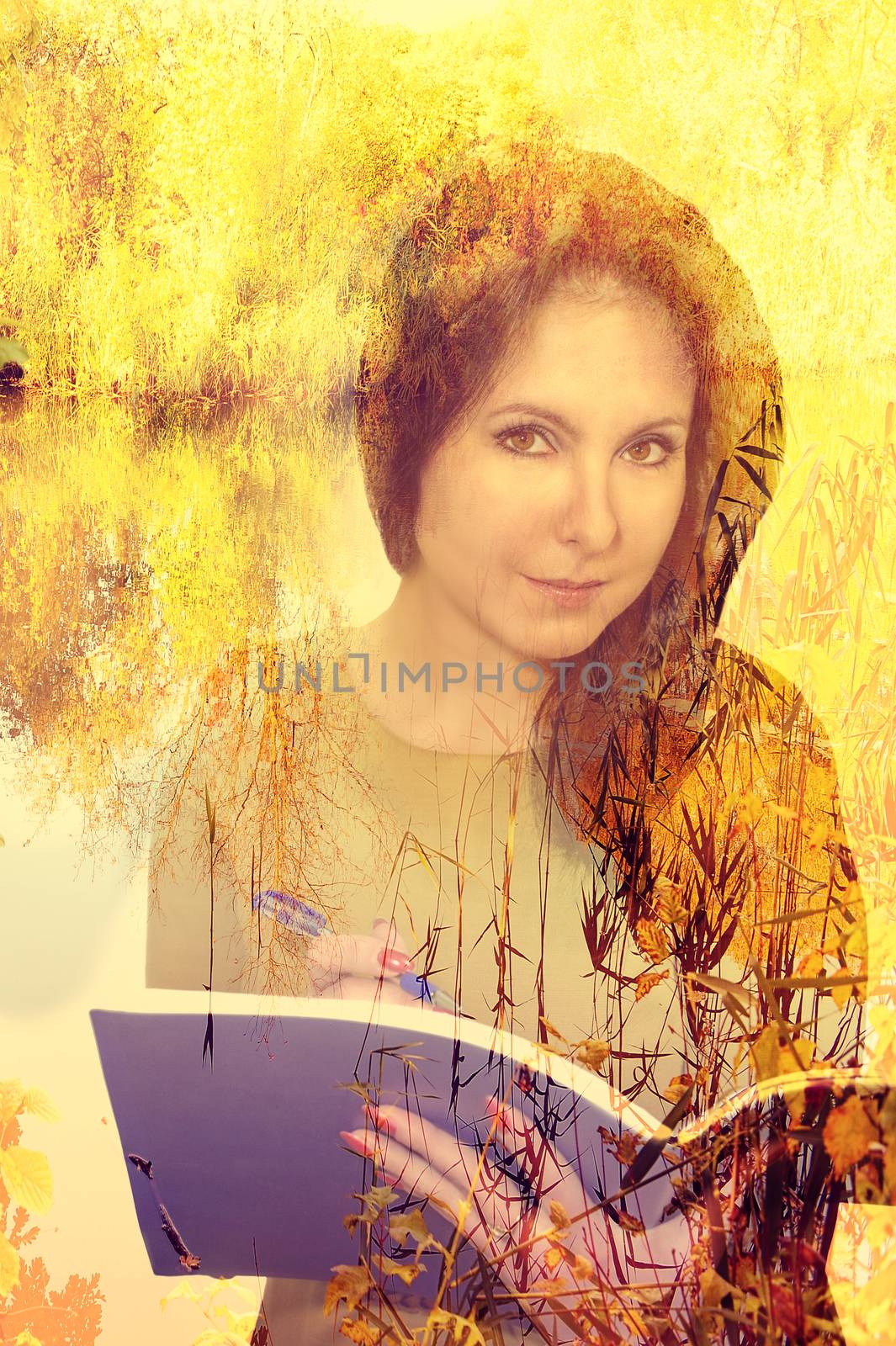 Beautiful girl with a pensive look holds a book, tree branches, a double exposure.