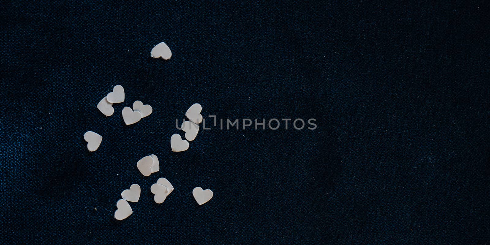 St. Valentine card concept with heart shaped decor on wooden background with copy space