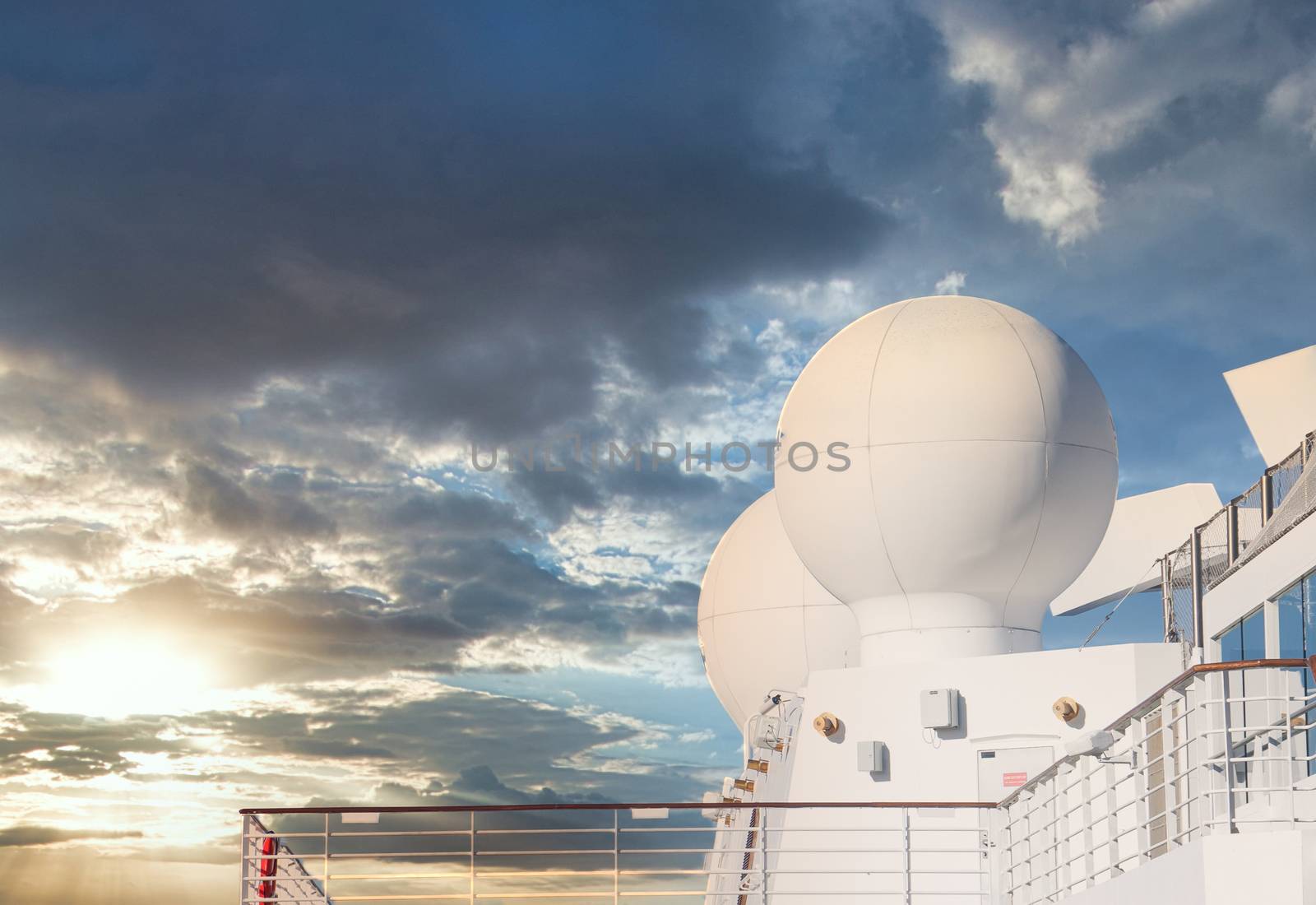 White Satellite Equipment on Ship at Sunset by dbvirago