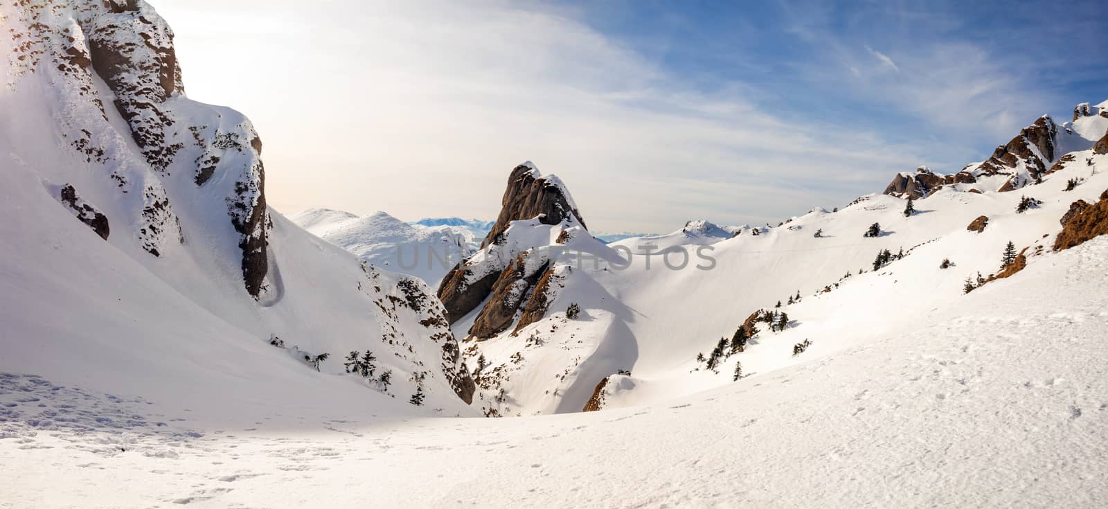 Panoramic view of Mount Ciucas peak at a sunset on winter by PixAchi