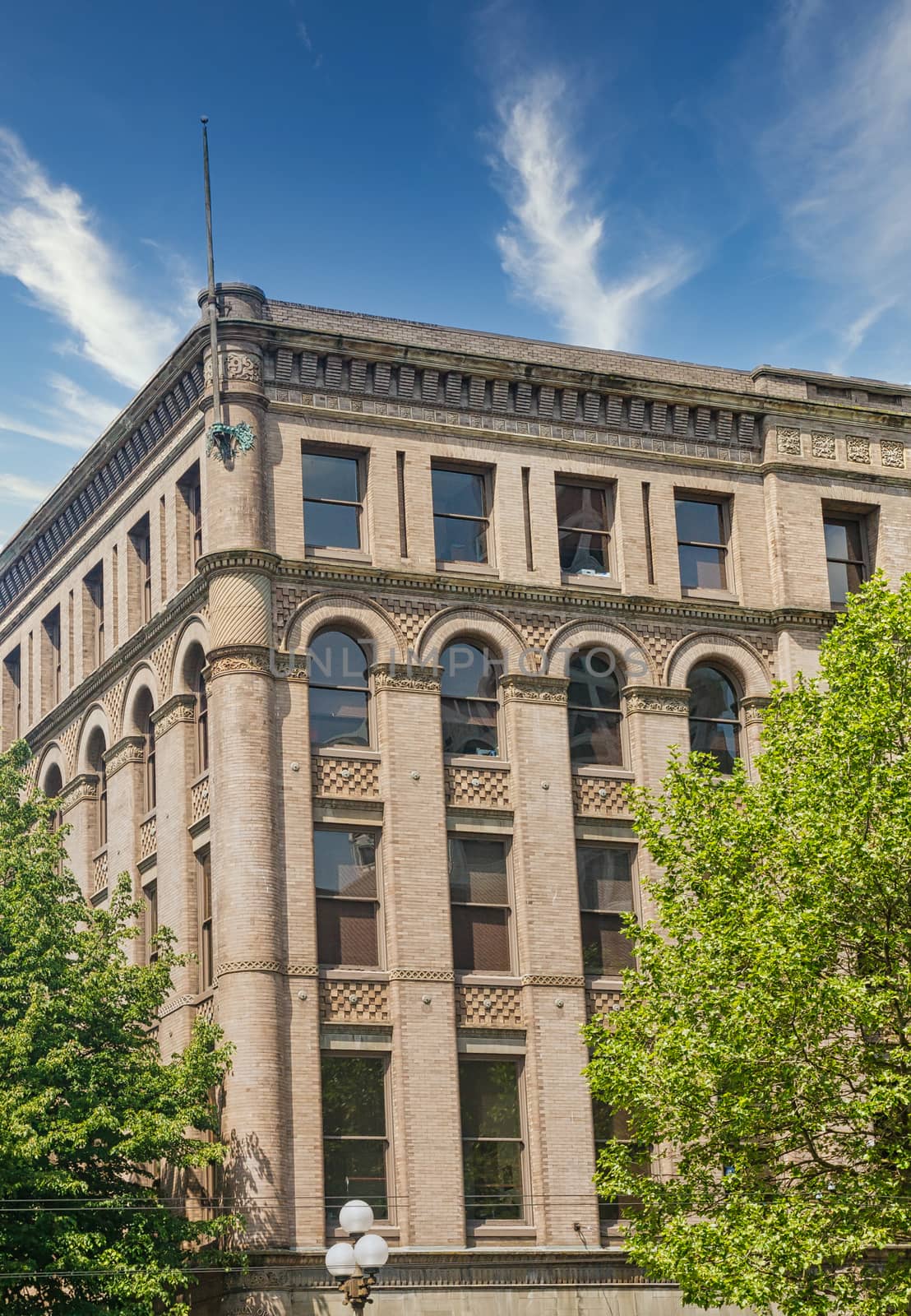 A large, old, classic, brick office building in Seattle