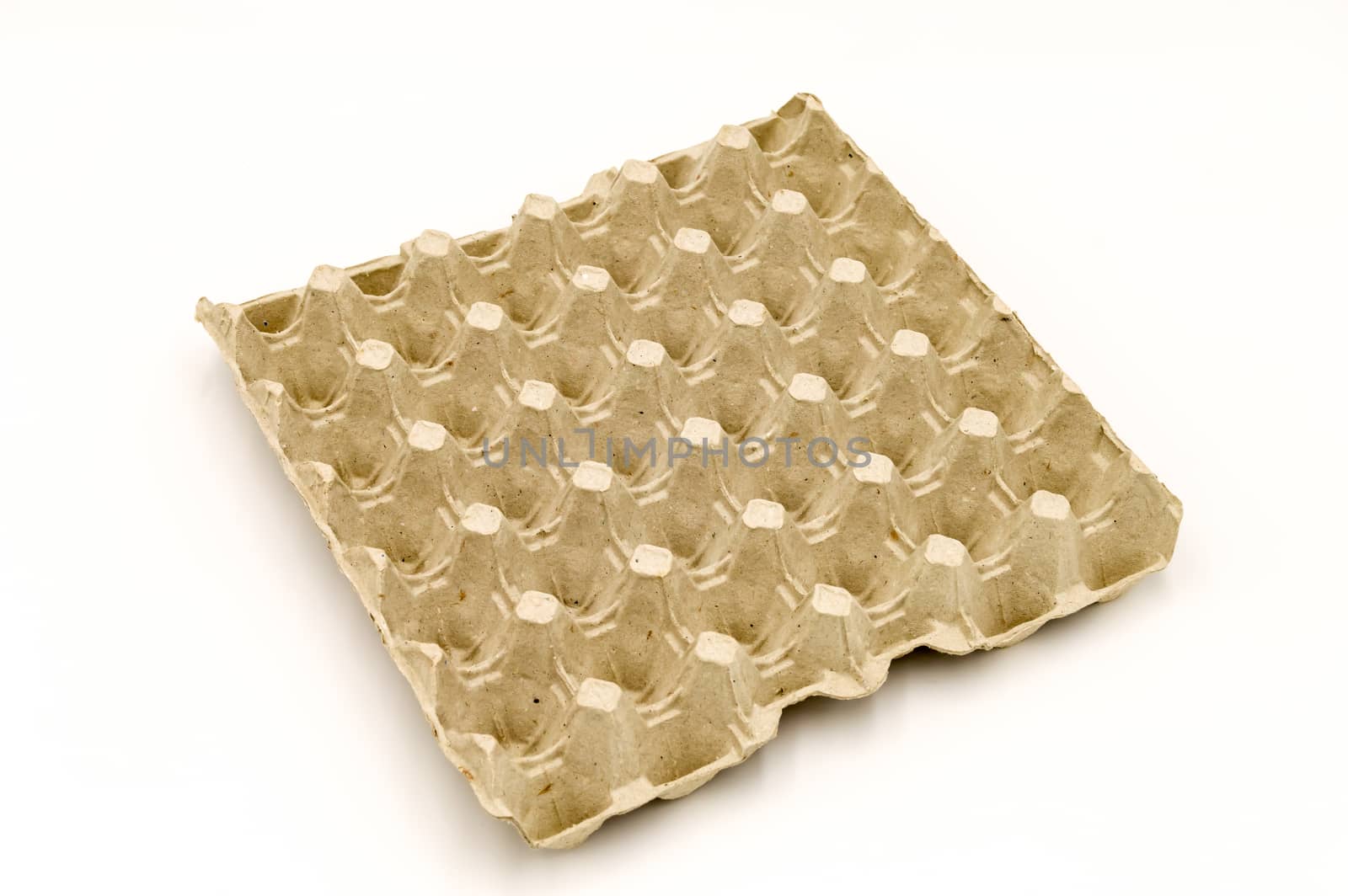 Empty cardboard egg tray on a white background