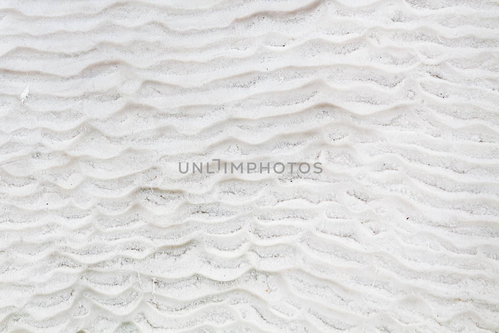 The view across a white travertine terrace in Pamukkale, southwestern Turkey.  The site is a UNESCO World Heritage Site.