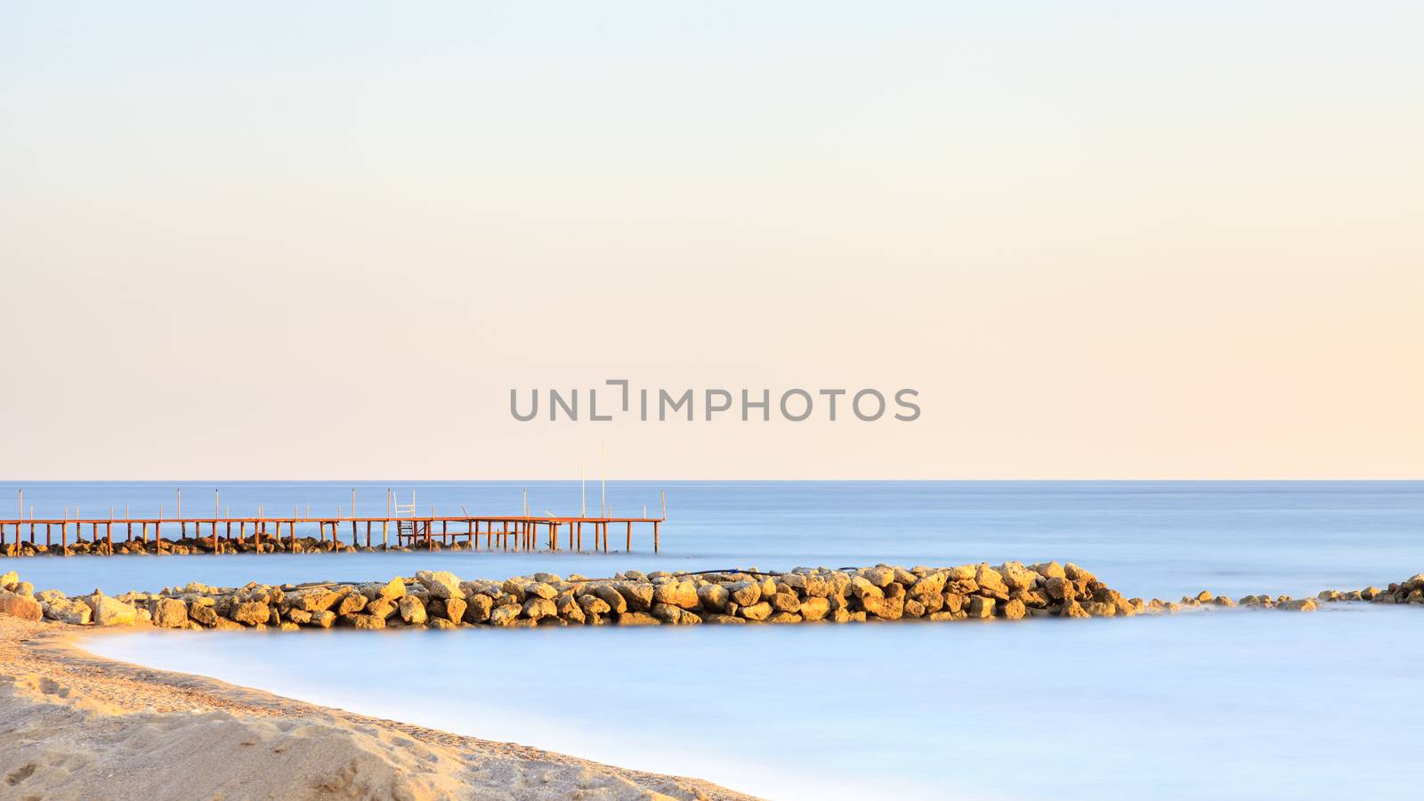 A long exposure of dusk over the Mediterranean Sea viewed from the southern Turkish coastline near Turkler.