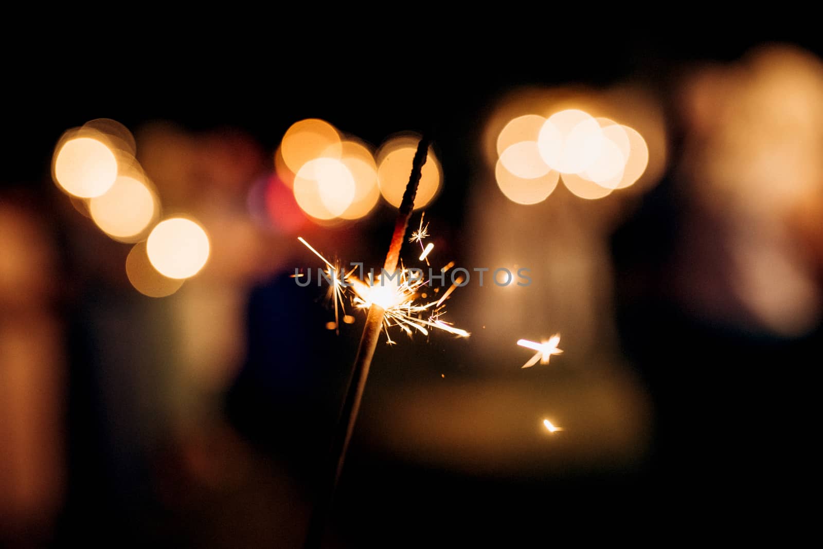 sparklers at the wedding, light on the background... by Andreua