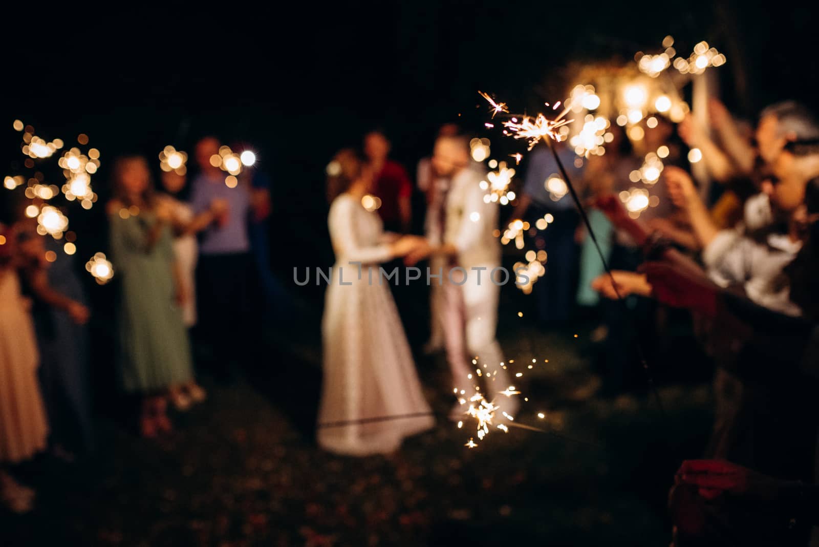 sparklers at the wedding,  on the background by Andreua