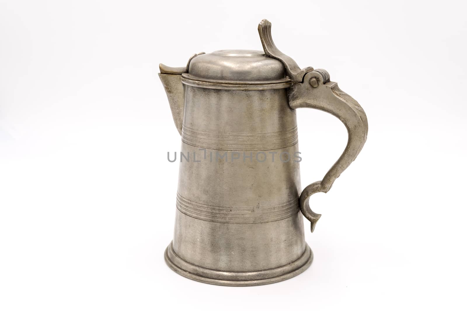 Old pewter wine jug on a white background