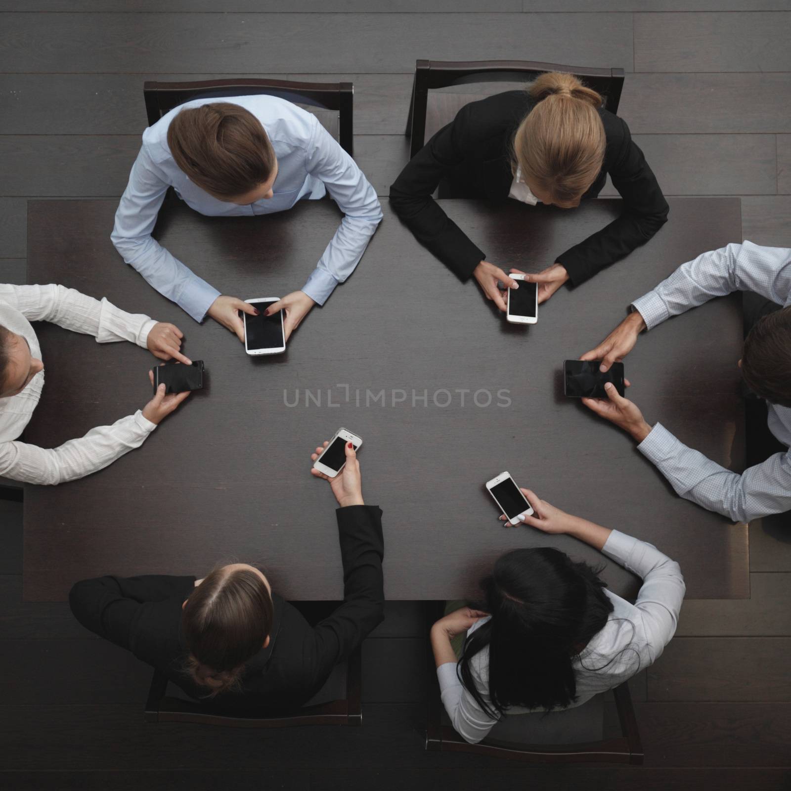 Business people with phone by ALotOfPeople