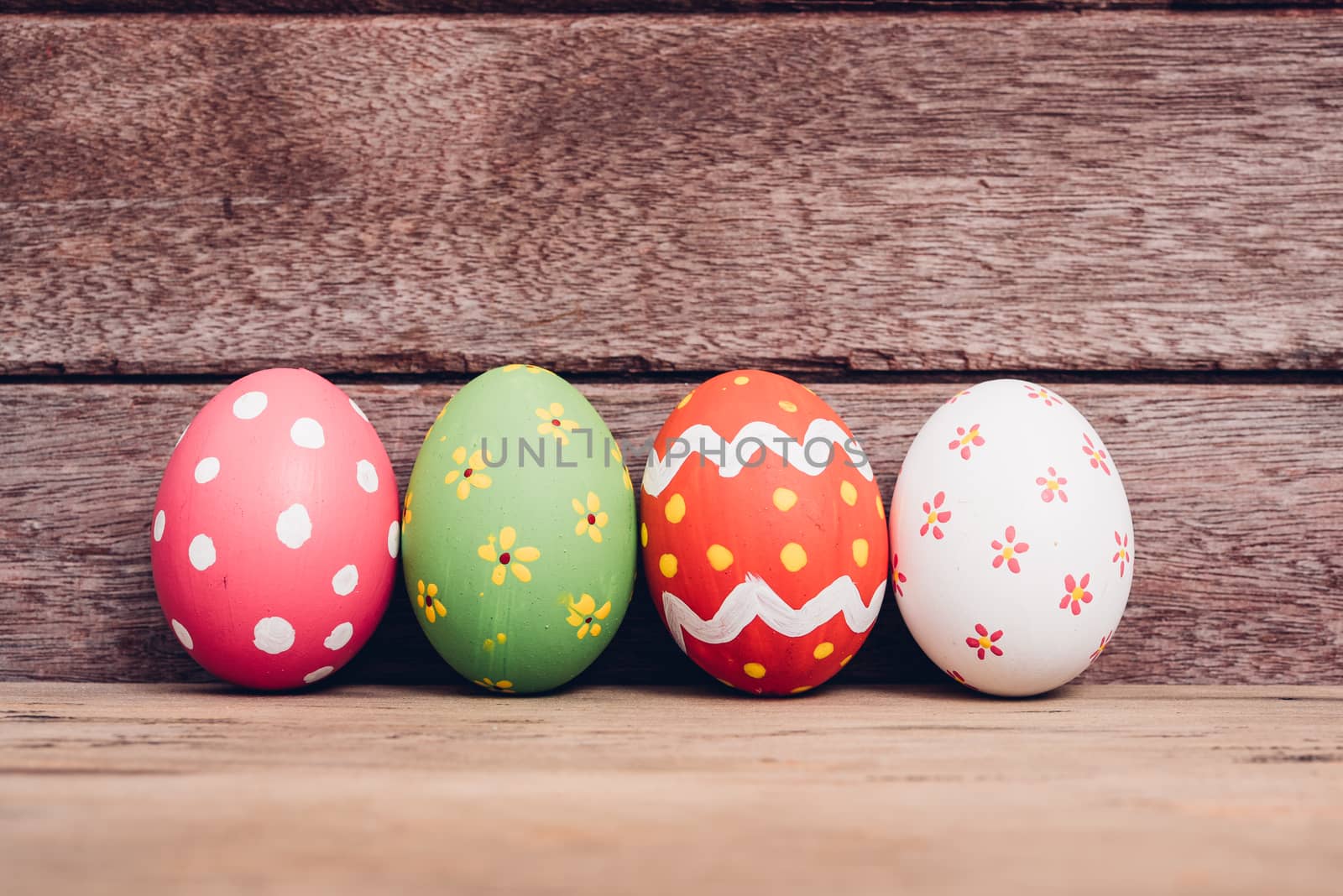 Beautiful Easter egg on wooden background, Easter day concept