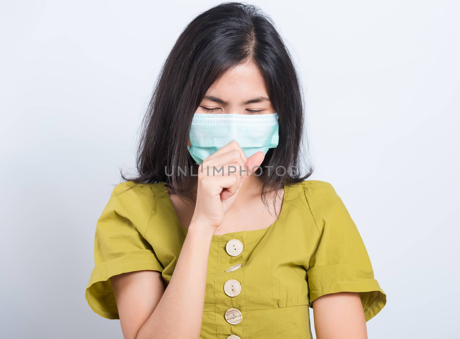 woman wearing face mask protects filter dust pm2.5 by Sorapop