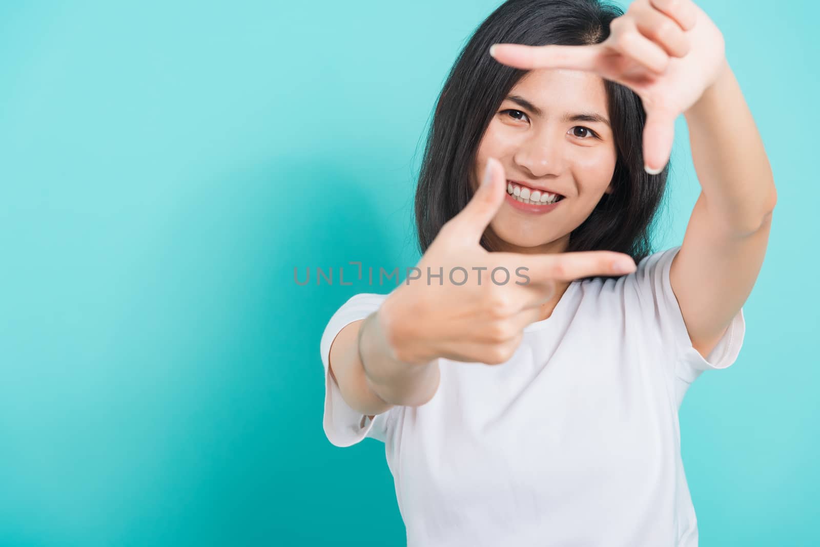 woman smile wear white t-shirt standing making creativity photog by Sorapop