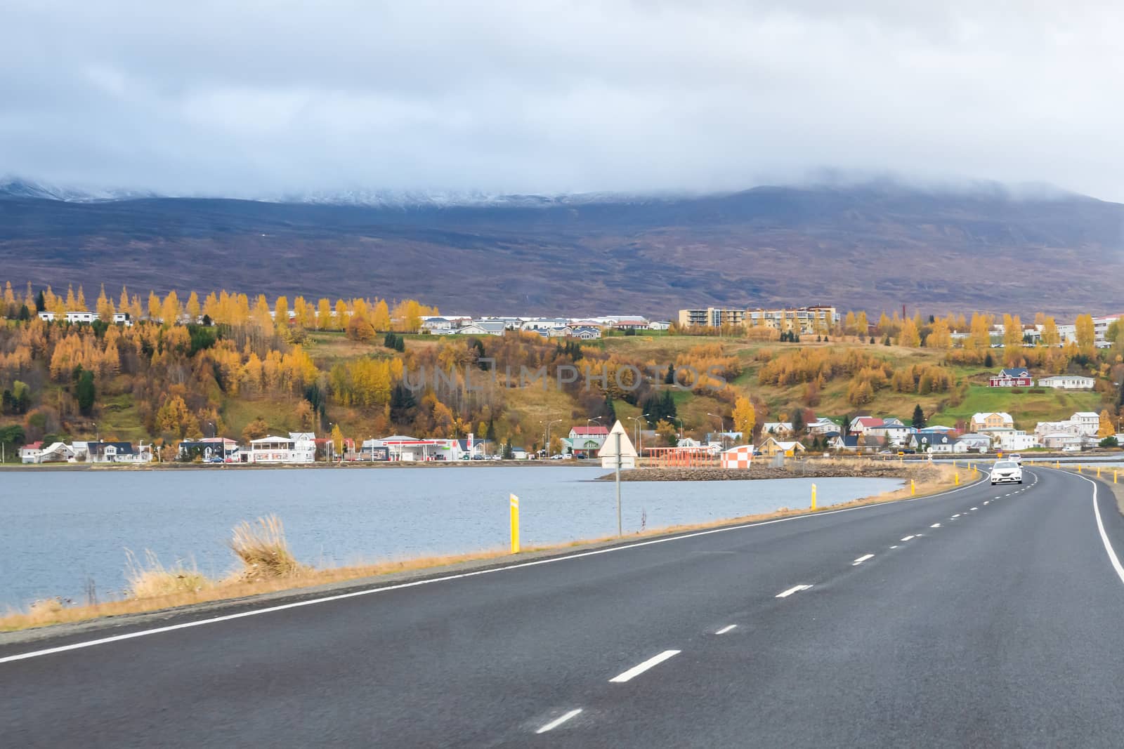 Akureyri biggest city of the North in Iceland road embankment crossing fjord by MXW_Stock