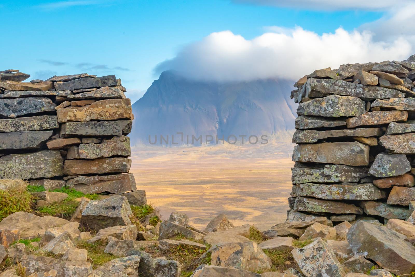 Borgarvirki mountain castle in Iceland view through ancient wall towards valley and next mountain by MXW_Stock