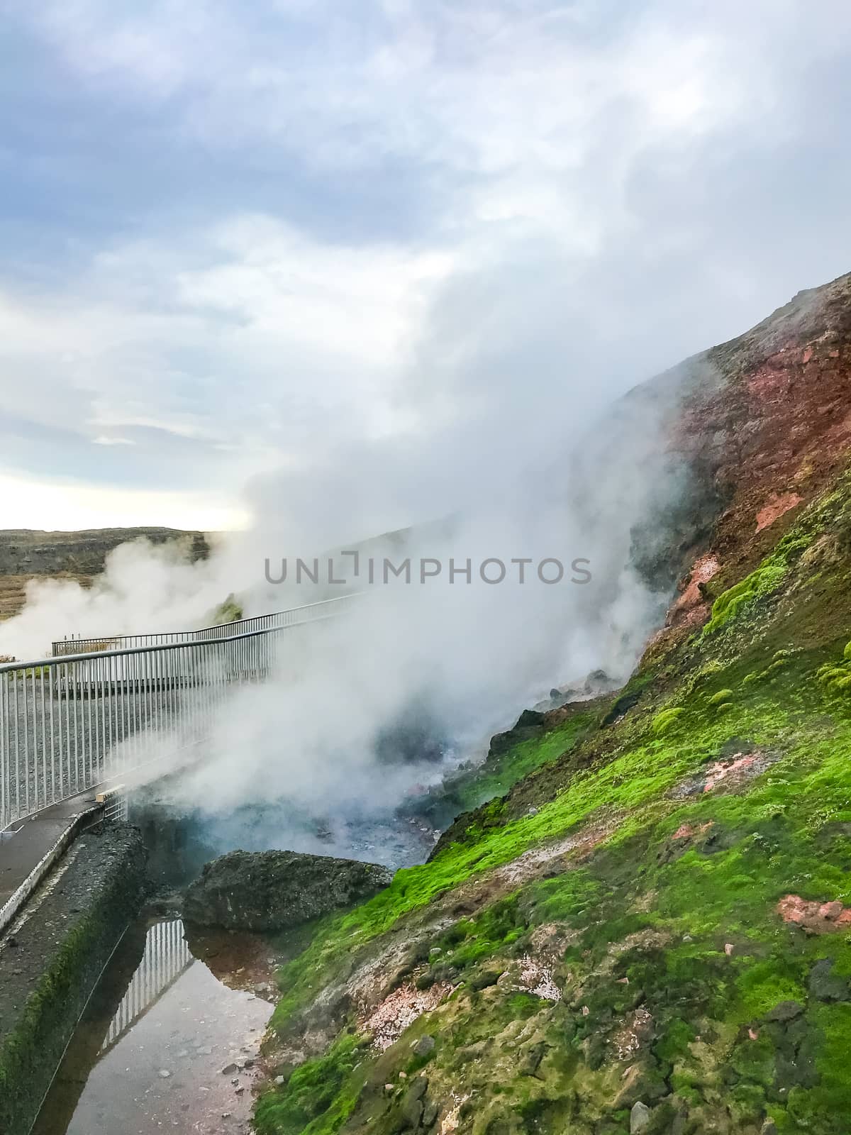 Deildartunguhver geothermal hot spring area hot pools and boiling water by MXW_Stock