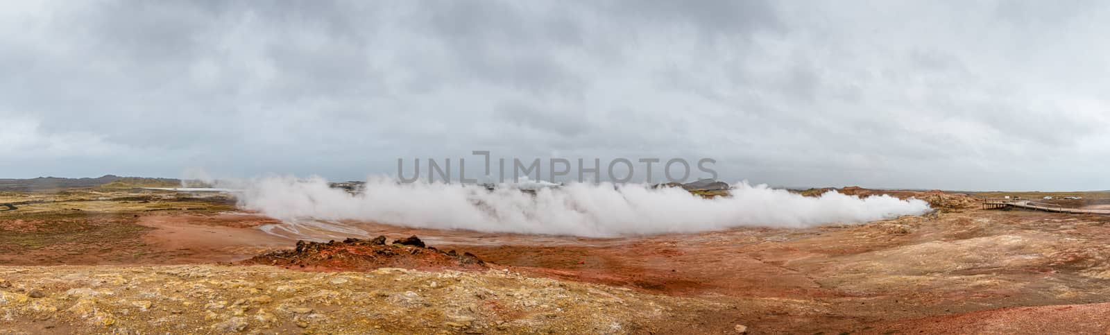 Geo Thermal hot spring activity in Iceland Gunnuhver Hot Springs steam cloud during storm by MXW_Stock