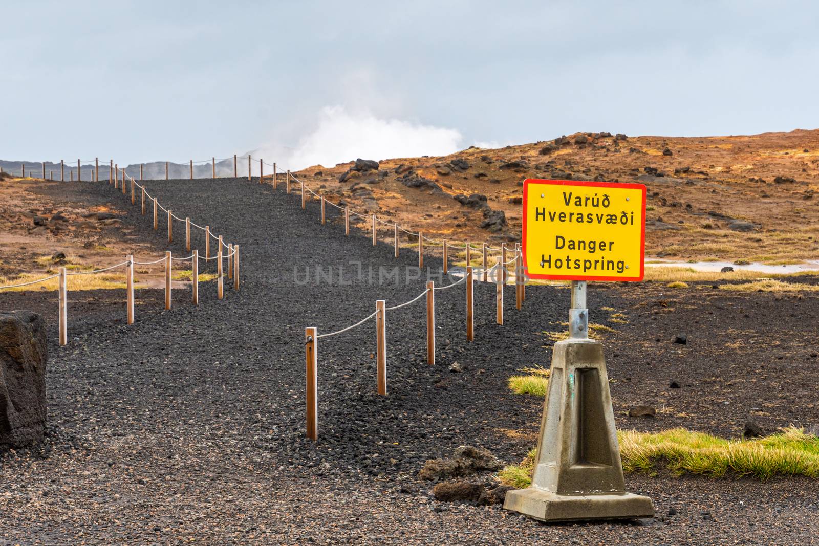 Geo Thermal hot spring in Iceland Gunnuhver Hot Springs warning sign by MXW_Stock