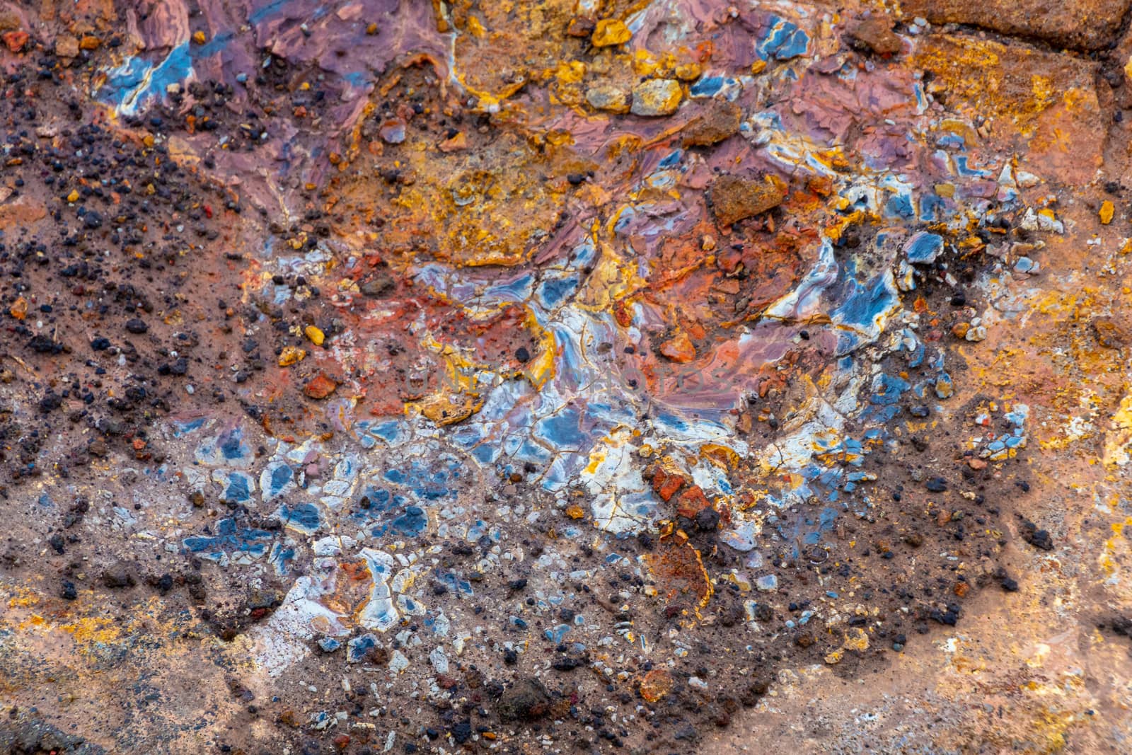 Geo Thermal hot spring in Iceland Gunnuhver Hot Springs muddy colorful rock sediments on rocks