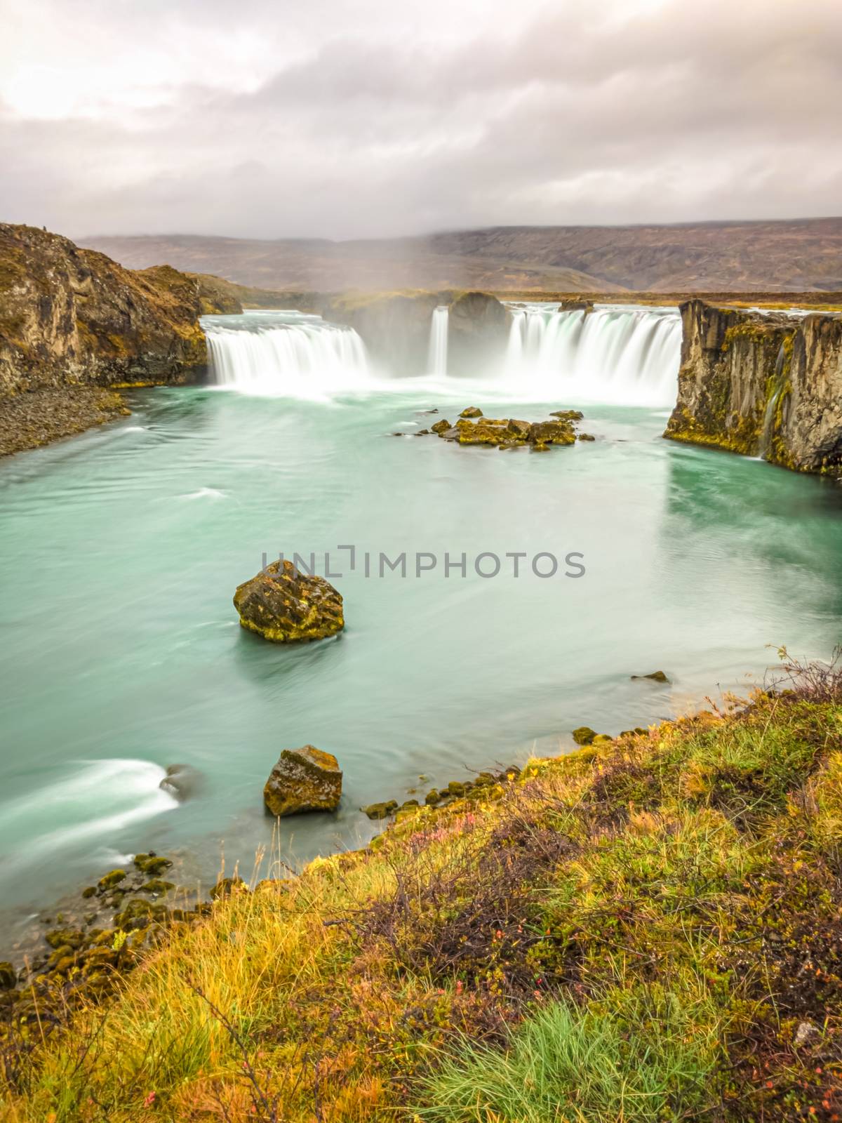Godafoss waterfall in Iceland long exposure during autumn by MXW_Stock