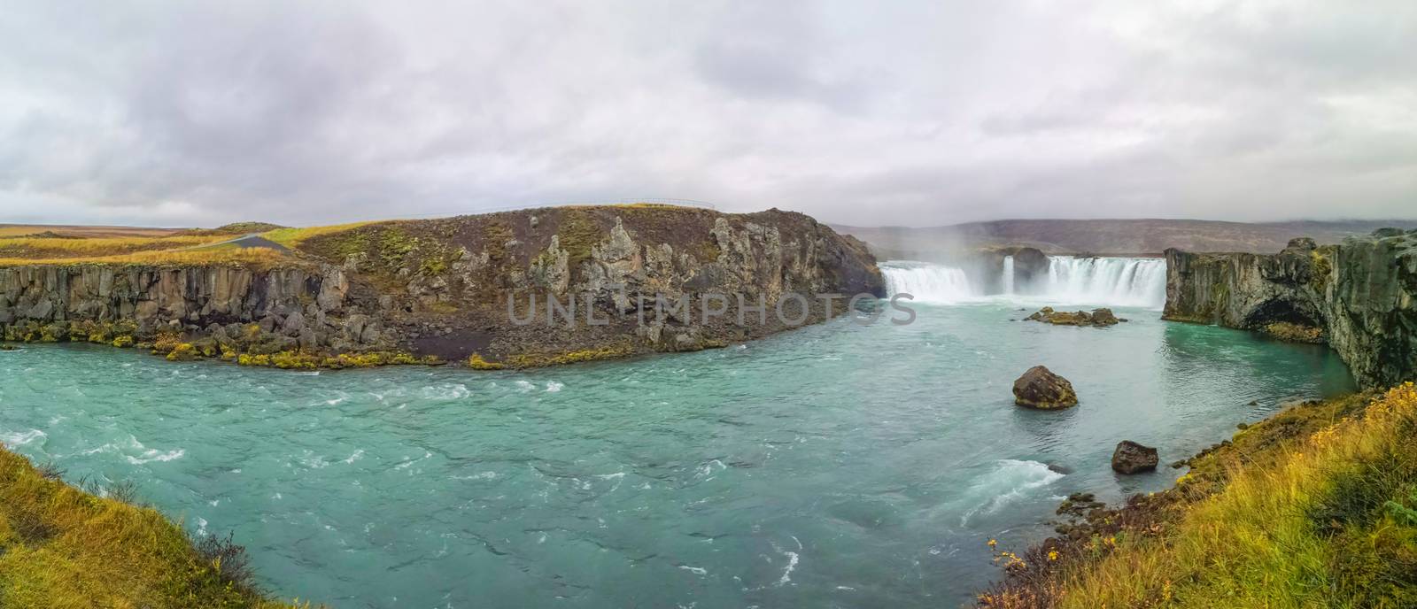 Godafoss waterfall in Iceland panorama of plunge pool turquoise water by MXW_Stock