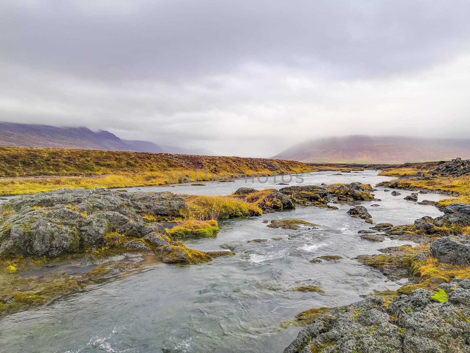 Godafoss waterfall in Iceland river bed behind the waterfall