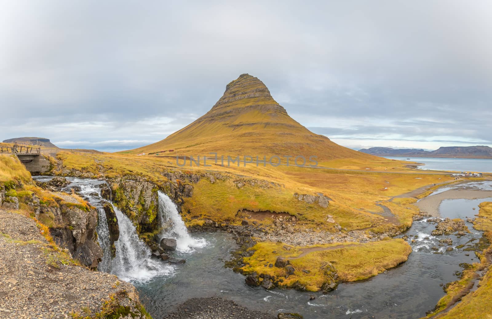 Kirkjufell in Iceland Kirkjufellsfoss waterfall panorama of fall and the famous mountain