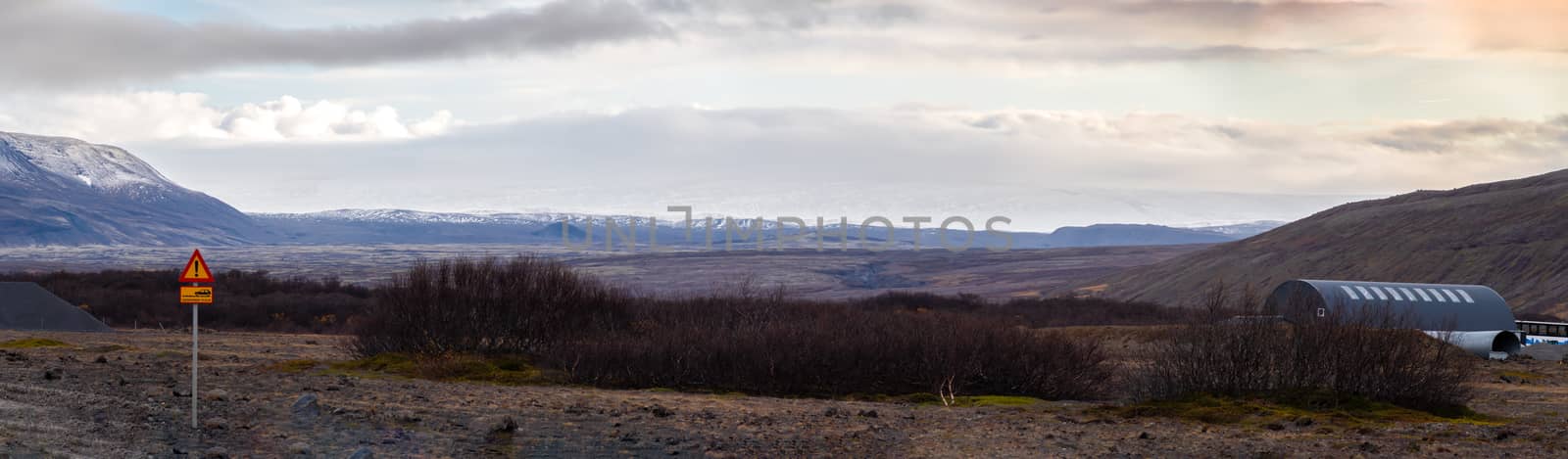 Langjoekull glacier in Iceland snow white ice giant covering mountain top behind huge lava field by MXW_Stock