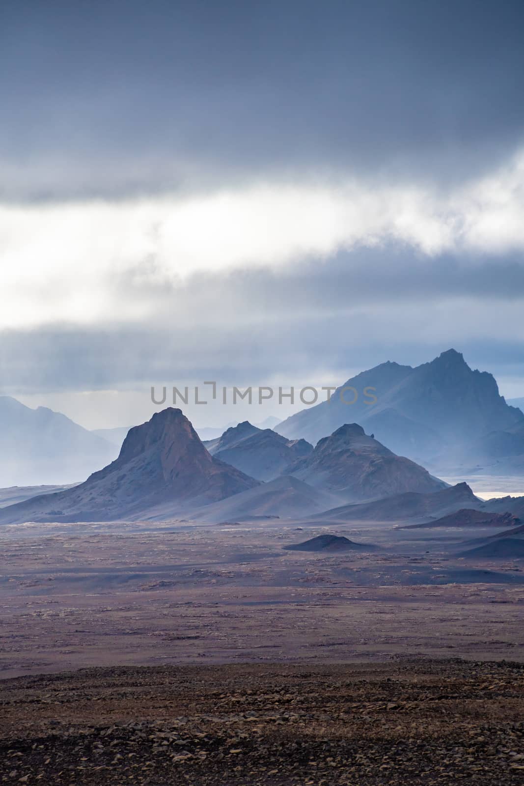 Langjokull Glacier epic mountain formations under dark clouds by MXW_Stock