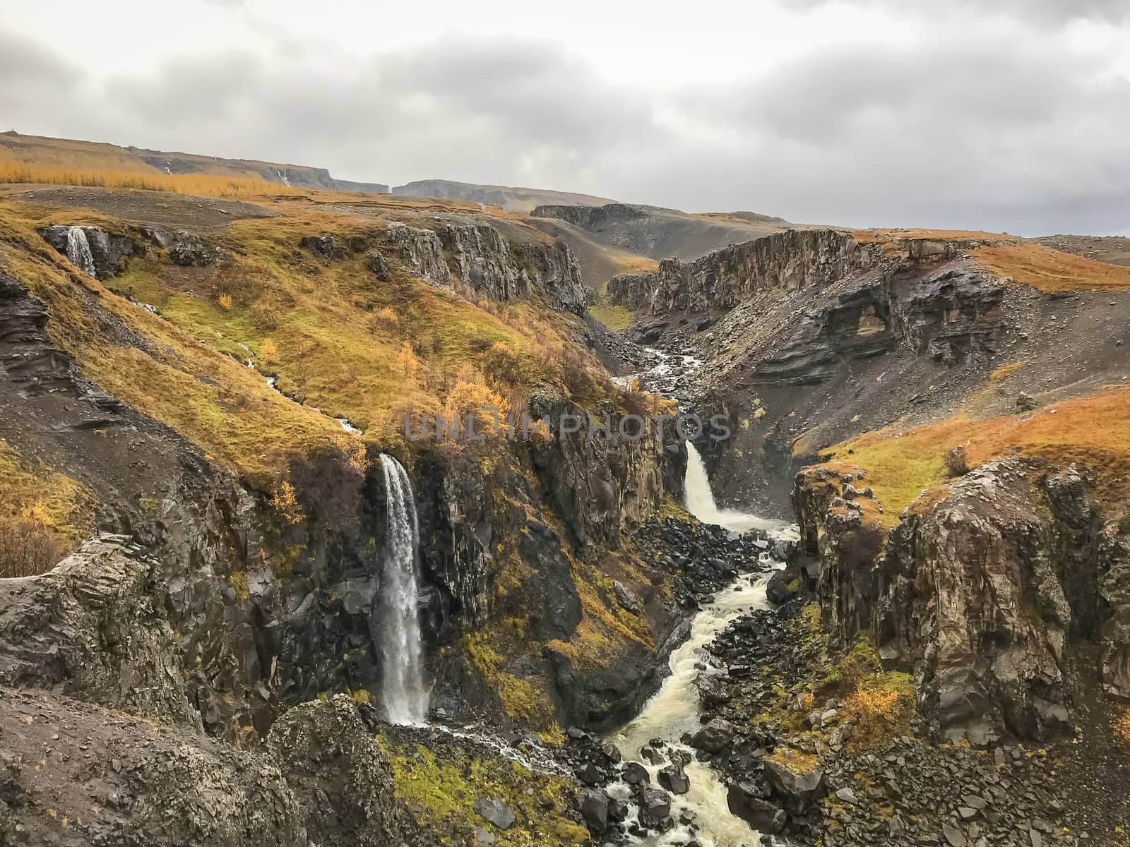 Litlanesfoss and Hengifoss waterfall in east Iceland during rain weather