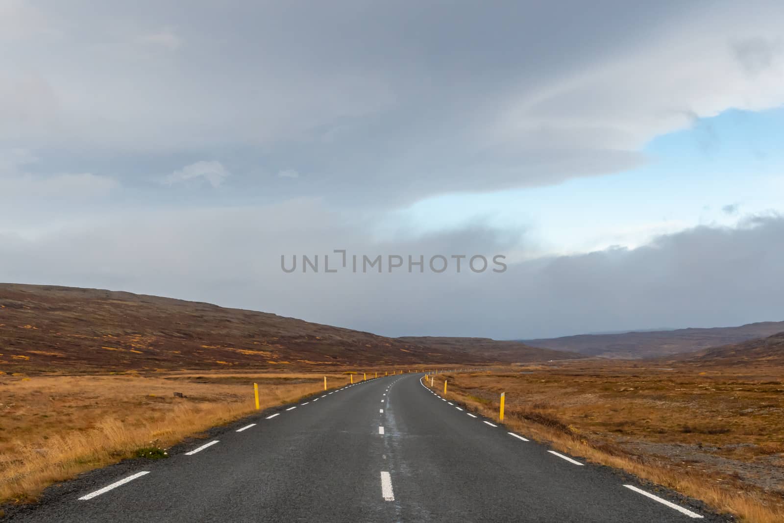 Road trip in Iceland driving over mountain pass in Westfjords during autumn