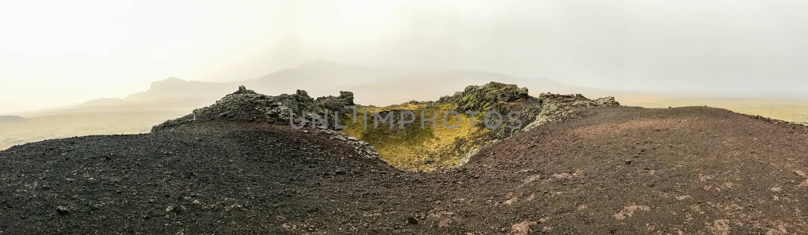 Snaefellsness national park in Iceland panorama from top of volcano during foggy day black and red rocks