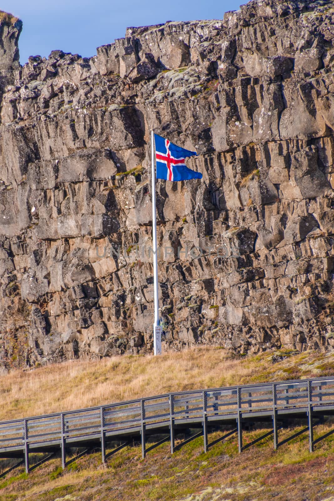 Thingvellir National Park in Iceland icelandic flag in front of Loegberg mountain
