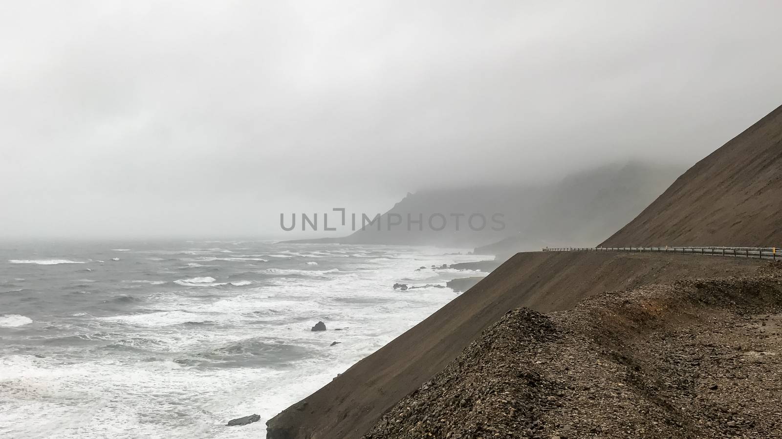 Volcanic mountains of Iceland meeting Atlantic Ocean at Eastfjords in east Iceland by MXW_Stock