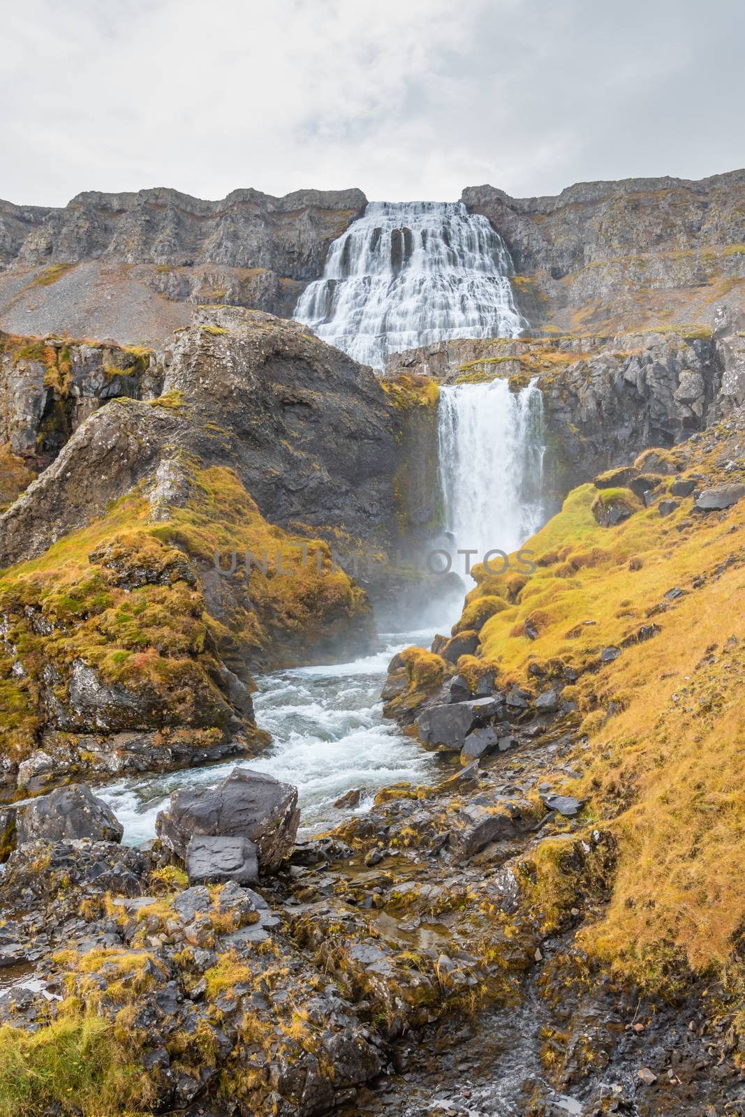 Westfjords of Iceland Göngummanafoss and Dynjandi waterfall during rainy weather in autumn by MXW_Stock