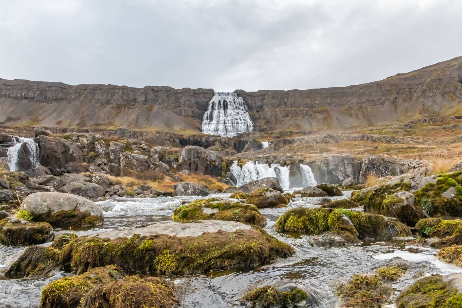 Westfjords of Iceland Göngummanafoss waterfall Dynjandi river bed by MXW_Stock