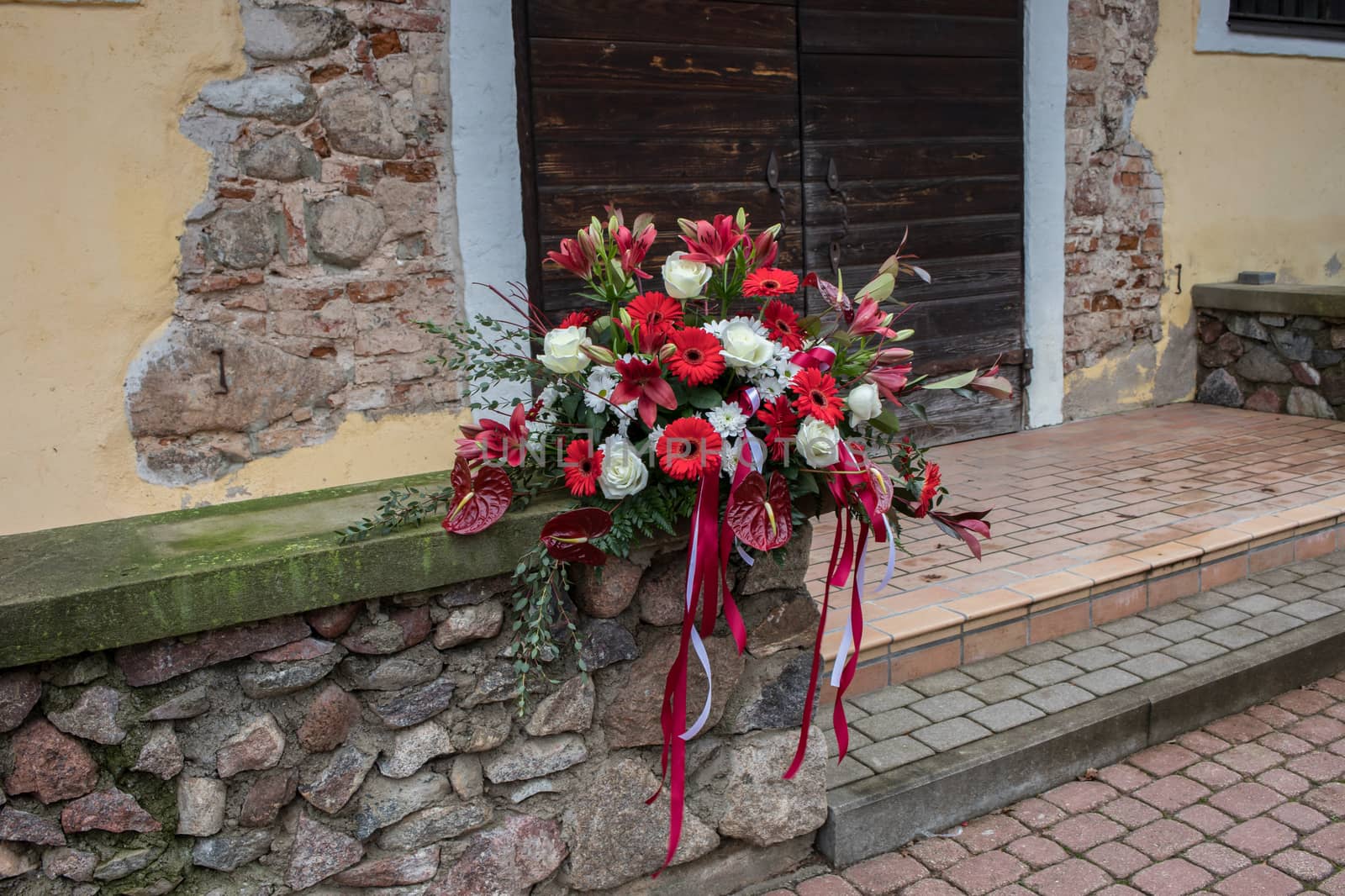 Floral composition on the background of the castle wall, rose