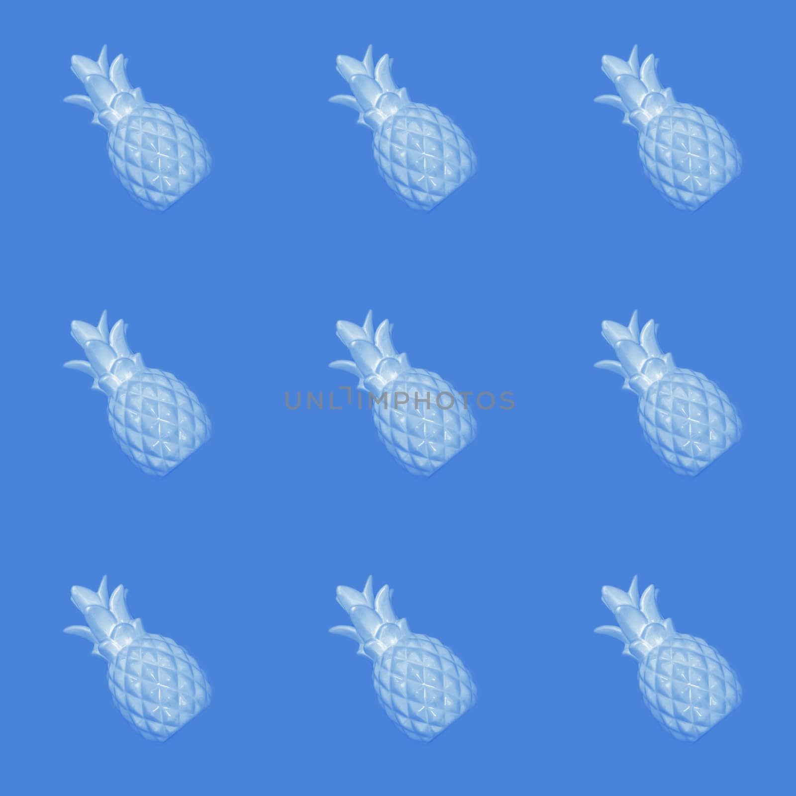 Seamless abstract background of blue pineapples on a blue background.